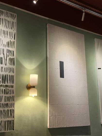 The three minimalist cafe paintings seen together. Their large scale and simple, bold graphics make a huge impact in the space.