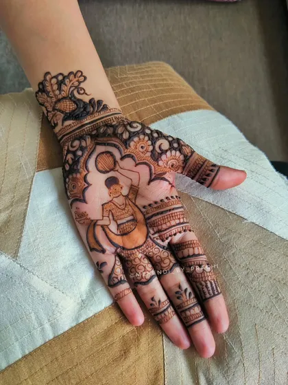 This single-hand design captures a playful moment, with a man offering a drink to his partner. It's a fun and personal way to celebrate Karwa Chauth, framed by a peacock cuff at the wrist.
