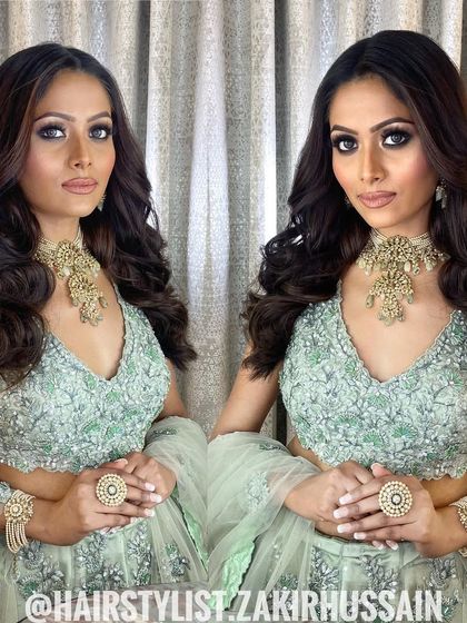 A mirrored image of the client with her soft waves, showing the symmetry and beauty of the style.