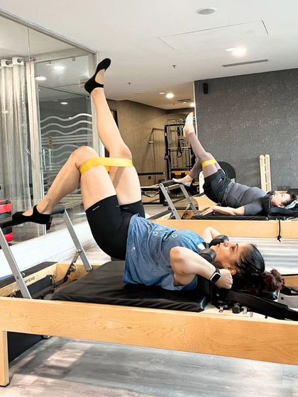 The burn is part of the process. This single leg bridge with a resistance band on the Reformer is a powerful way to isolate and strengthen the glute muscles.
