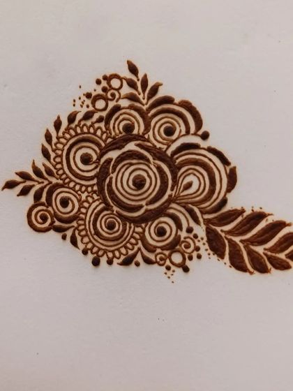 A lovely floral bunch created with a gulf-style rose and bold leaves. This type of design is very popular for parties and festivals as it's both quick and beautiful.