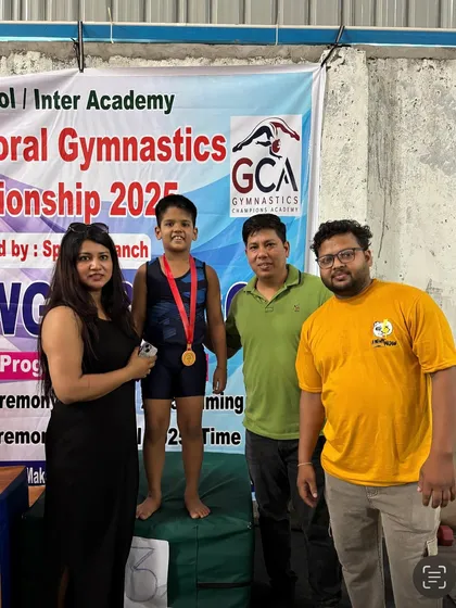 Another one of our students proudly displaying his medal on the winner's podium.