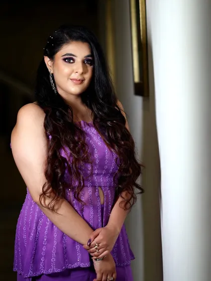 A close-up portrait of a guest, focusing on her expressive eyes and beautiful hair. I work to make everyone feel comfortable in front of the camera.