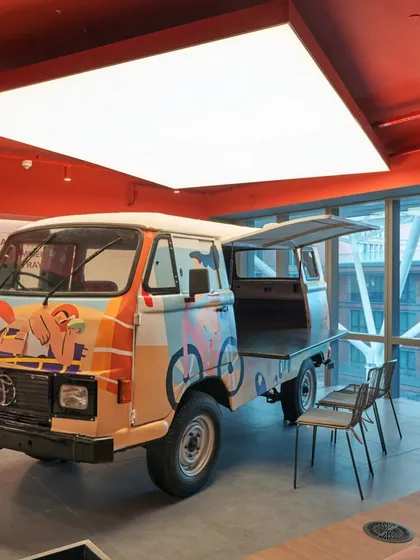 We brought a real Tata Ace truck into this office and converted it into a unique meeting and breakout spot. The truck is painted with colorful graphics, adding a quirky and memorable feature.