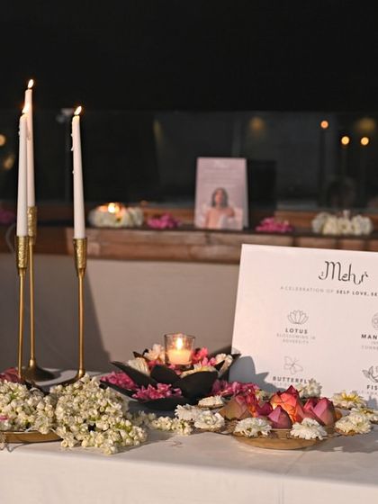 The elegant, candle-lit display for the 'Mehr' collection launch, setting a sophisticated and celebratory mood for the evening.