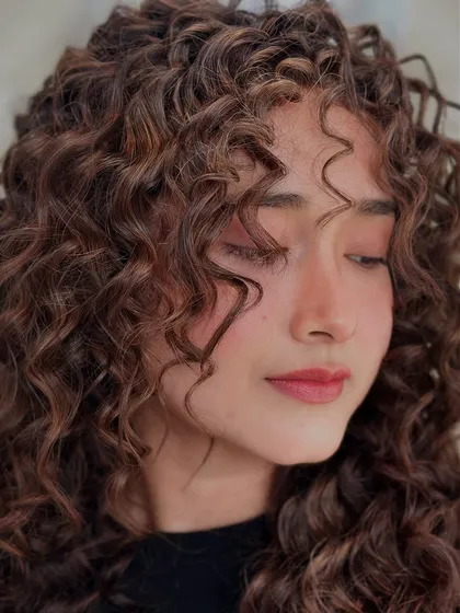 A soft, dreamy shot of these colored curls. The highlights add a beautiful, sun-kissed effect.