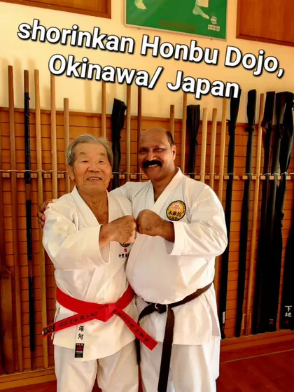 With my teacher at the Shorinkan Honbu Dojo in Okinawa, Japan. This connection is the heart of my teaching. I ensure that the karate you learn here is the same pure, traditional martial art practiced at its source.