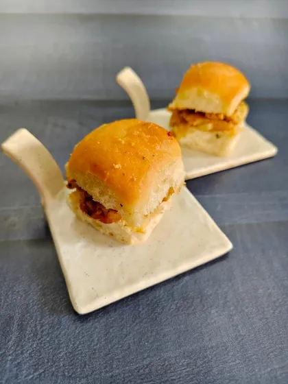 Small bites, big flavors. We're bringing the streets to your plate with these soft buttery pav stuffed with a mouth-watering filling, served as bite-sized happiness.