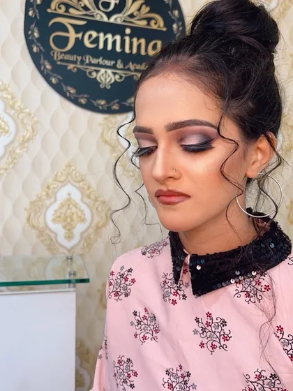 A close-up of the eye makeup for this party look. I used a blend of silver and black eyeshadows to create a dramatic smokey effect, balanced with a neutral lip.