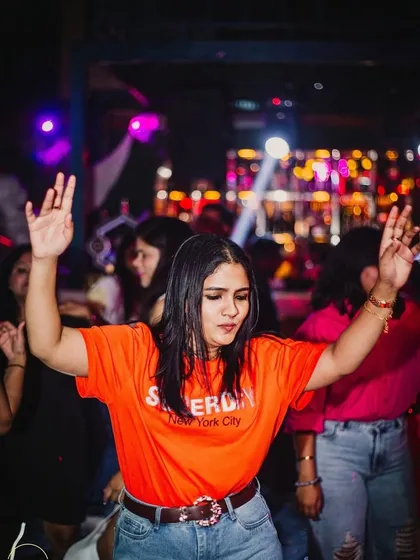 The crowd dancing and feeling the music.