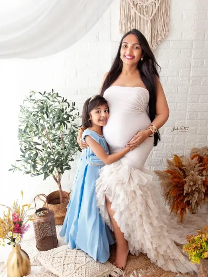 A beautiful moment between a mother and her daughter as they wait for the new baby. Maternity sessions can be a wonderful way to include older siblings in the celebration.