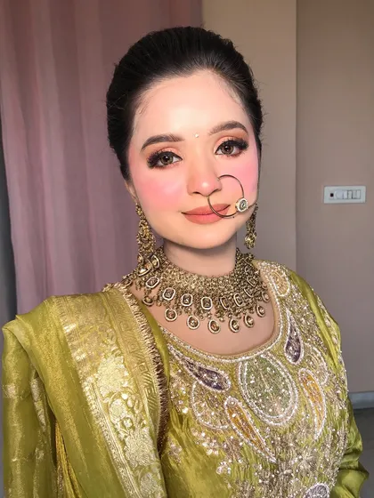 Another beautiful portrait, her rosy cheeks and soft makeup complementing the jewelry.