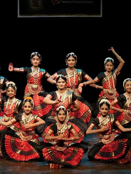 A powerful group performance by my students in striking red and black costumes. Their energy and synchronization are captivating.