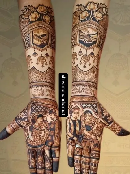 This design features beautiful couple portraits on the palms, with the forearms decorated with hanging jhumkas and other delicate traditional elements.