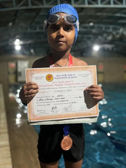 Well done, Dhruv. Holding his certificate of merit after winning a medal at the New Delhi YMCA Invitational Aquatic Championship held at the prestigious Talkatora stadium.