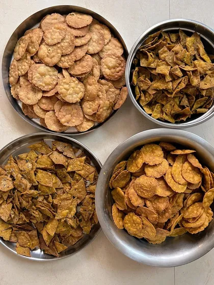 A variety of homemade mathris and puris. Each batch is made with fresh ingredients and traditional recipes, ensuring an authentic and delicious taste.