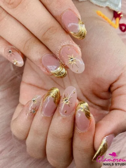 Dripping in luxury. This glamorous set features a soft nude base adorned with sculpted gold swirls and celestial starbursts, finished with delicate rhinestone accents. It’s the perfect manicure for a wedding, festival, or any day you want to feel extra special.