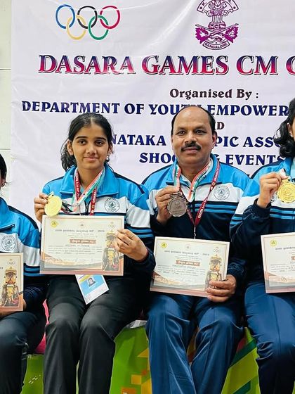 Our accomplished shooters, including myself, with our medals from the 25m and 50m events at the Dasara Games CM Cup.