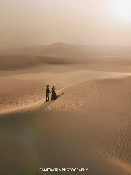 An epic, cinematic portrait from a pre-wedding shoot in the vast Thar desert. I use landscapes like this to create artistic, soulful images that feel like a still from a movie, telling a story of love against a grand backdrop.