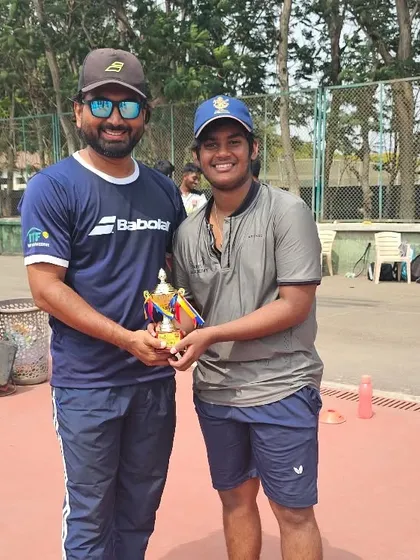 A proud moment for one of our younger men's team members, receiving his winner's trophy.