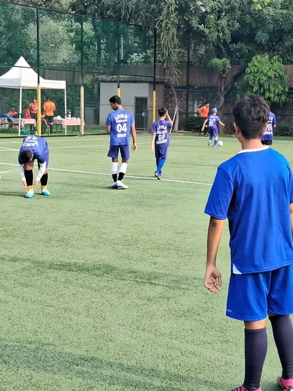 Players in position during the match against the American school team. Maintaining formation and tactical discipline is crucial.