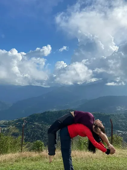 Yoga is often a personal journey, but it is powerful when shared. On my retreats, we support each other, practice together, and build a community against the backdrop of the world's most stunning landscapes, like these mountains in Nepal.