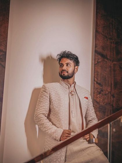 A cool and stylish portrait of the groom, using architectural elements and shadows.