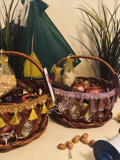 Our traditional Sankranti hampers in decorated wicker baskets. They are packed with tilgul, sweets, and peanuts, perfect for gifting.