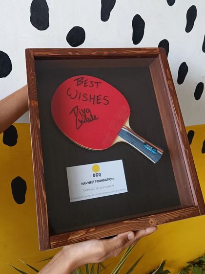 A duplicate of 109, we also crafted this unique wooden shadow box to hold a table tennis paddle autographed by the young star Diya Chitale.