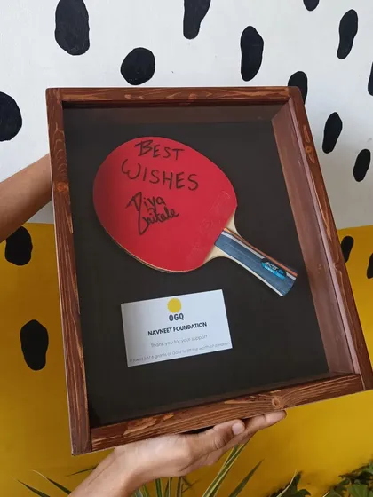 A duplicate of 109, we also crafted this unique wooden shadow box to hold a table tennis paddle autographed by the young star Diya Chitale.