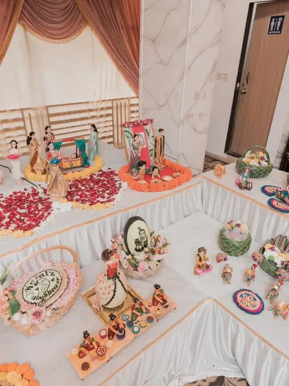 Another angle of the grand baby shower setup, showing the U-shaped arrangement that allows guests to walk around and admire every detail.