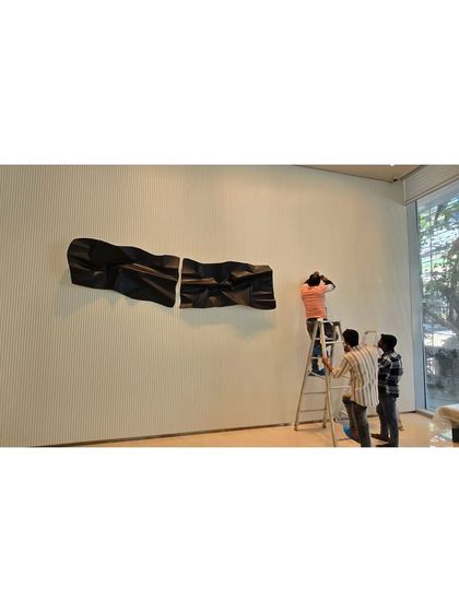 Carefully aligning the multiple panels of the wall installation is a critical step.