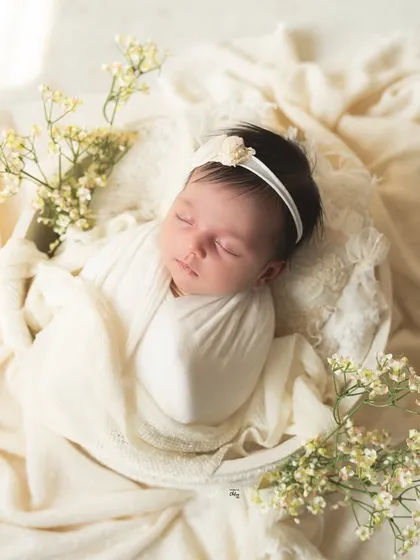 The warm sunlight adds a golden glow to this serene portrait. I love using natural light to create soft, dreamy, and timeless baby photos.