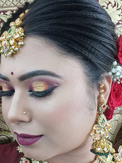 A close-up of a dramatic bridal eye makeup look with a gold cut-crease, created as a demonstration for my advanced students.