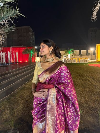 Dressed in a traditional saree for a wedding event. I love dressing up for festive occasions and adding to the celebratory mood.