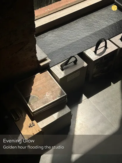 Evening glow. Golden hour flooding the studio, highlighting the material samples and quiet corners of our workspace.