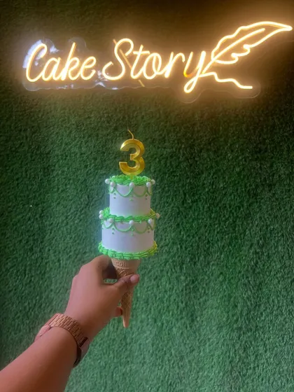 My trending cone cake. This fun and unique design features a mini two-tier cake served on top of an ice cream cone, perfect for a quirky celebration.