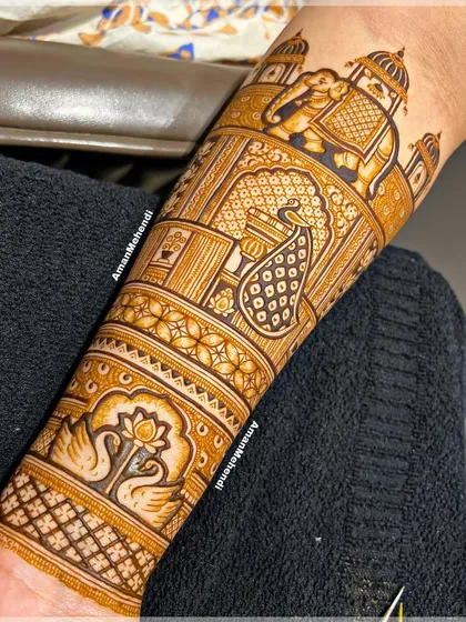 One of my favorite designs of the season, this arm piece features a majestic elephant, a detailed peacock, and beautiful swan motifs, all set against a backdrop of palace architecture.
