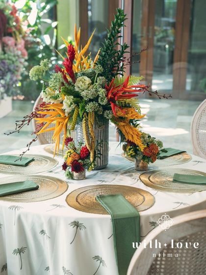 A full tablescape from the 'Garden of Gaia' baby shower, showcasing the custom linens and vibrant centerpieces.