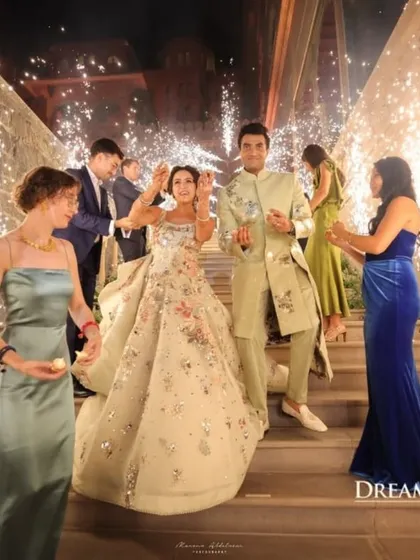 A grand entrance for the couple, complete with sparklers held by guests. I coordinate these moments to ensure they are safe, beautiful, and perfectly timed.