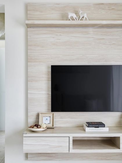 The TV unit exudes Scandinavian elegance with its clean lines and light wood tones. Designed for both style and function, it seamlessly integrates technology while maintaining a minimalist aesthetic.