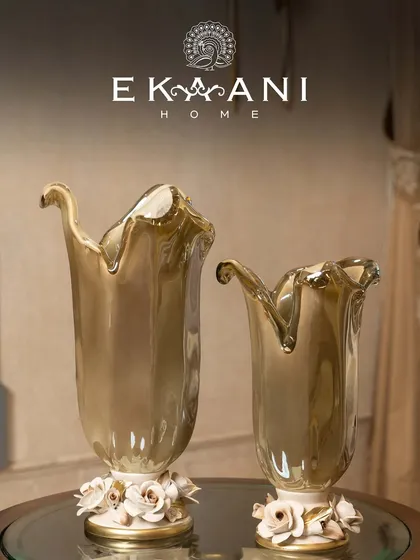 Crafted in Murano, admired everywhere. These vases, with their flowing forms and delicate porcelain rose bases, blur the line between decor and art, bringing a touch of Italian luxury to your home.