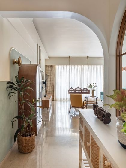 A Home rooted in tradition and timeless elegance. In a concrete jungle that never sleeps, our clients wanted a home that exudes tranquility and tradition. We thus created a space that has traditional details woven in seamlessly with modern features that blend comfort and tranquillity,’ rooted in tradition and timeless elegance. Our emphasis on the connection to nature and traditional elements shone a spotlight on using natural materials like wood, veneers, cementous textures to bring the earthy feel. Since these materials can bring so much warmth and cosiness to the space, they allow the home to become a peaceful sanctuary for the residents.