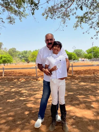 A proud father with his son after a competition. The satisfaction of our riders and the happiness of their parents are what matter most to us.