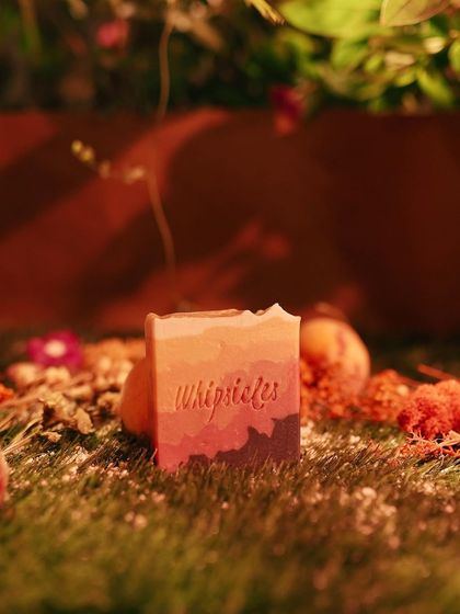 The Just Peach Drama cold process soap, featuring a beautiful layered design reminiscent of a peach sunset.