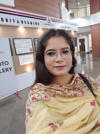 Standing by the "Grit & Resolve" photo gallery at the UP Police headquarters.