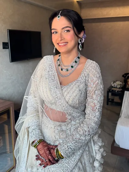 Another beautiful shot of this ivory dream. The soft makeup and elegant styling create a look of pure, timeless elegance for her reception.