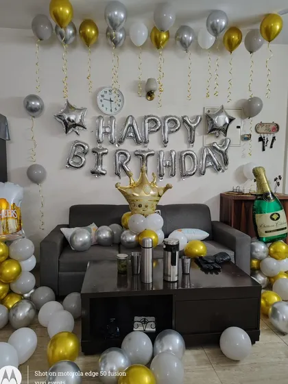 A closer look at the fun props and balloon arrangement for the home birthday party.