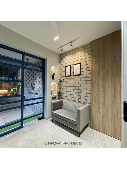 The waiting area of our studio, showing the glass-paneled door that offers a glimpse into our workspace. The design is transparent and modern, just like our process.