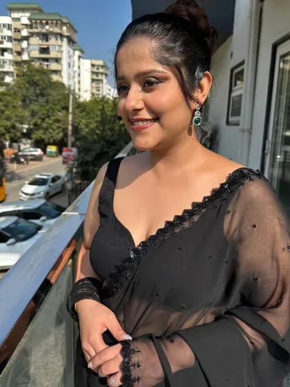 A soft glam look featuring a messy top knot bun and natural, glowing makeup that looks incredible in the sunlight. This is a great option for a daytime event or a casual party.